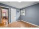 Comfortable bedroom with hardwood floors, neutral walls, and closet at 110 Starlite Dr, Carrboro, NC 27510