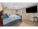 Spacious main bedroom with wood floors, natural light, and modern amenities at 110 Starlite Dr, Carrboro, NC 27510