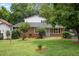 Well-maintained front exterior with lush lawn and mature trees at 110 Starlite Dr, Carrboro, NC 27510
