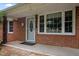Close-up of the brick facade and inviting front porch at 110 Starlite Dr, Carrboro, NC 27510