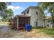 View of the home's rear exterior showing the screened-in porch and white vinyl siding at 110 Starlite Dr, Carrboro, NC 27510
