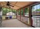 Relaxing screened porch with ceiling fan and views of the home's backyard at 110 Starlite Dr, Carrboro, NC 27510