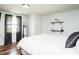 Bedroom features neutral paint, wood floors, and floating shelves at 1146 W Holt St, Mebane, NC 27302