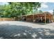 Large carport with ample parking space and equipment at 1146 W Holt St, Mebane, NC 27302