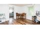 Dining room features wood floors and access to the kitchen, creating a bright and welcoming atmosphere at 1146 W Holt St, Mebane, NC 27302