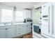 Efficient kitchen featuring white appliances and countertops at 1146 W Holt St, Mebane, NC 27302