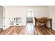 Living room features wood floors and access to the kitchen, creating a bright and welcoming atmosphere at 1146 W Holt St, Mebane, NC 27302