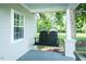 Relaxing porch swing and white columns give this home inviting curb appeal at 1146 W Holt St, Mebane, NC 27302