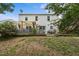 Spacious backyard featuring a partially covered deck, lush greenery, and privacy at 119 Tadworth Ct, Mebane, NC 27302