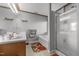 Well-lit bathroom with double sinks, a separate tub, and glass-enclosed shower at 119 Tadworth Ct, Mebane, NC 27302