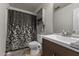 Well-maintained bathroom with a decorative shower curtain and a modern vanity at 119 Tadworth Ct, Mebane, NC 27302