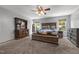 Spacious bedroom with beautiful decor, including a wooden dresser and floral bedding at 119 Tadworth Ct, Mebane, NC 27302