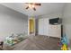 Spacious playroom with a ceiling fan and lots of room for activities at 119 Tadworth Ct, Mebane, NC 27302
