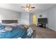 Cozy bedroom featuring a large bed and modern TV stand against neutral-colored walls at 119 Tadworth Ct, Mebane, NC 27302