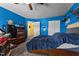 Bright blue bedroom with wood furniture, includes closet and doorway, offering a cozy and functional living space at 119 Tadworth Ct, Mebane, NC 27302