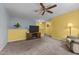 A versatile bonus room with TV, comfortable seating, and carpet flooring offers extra space for entertainment and relaxation at 119 Tadworth Ct, Mebane, NC 27302