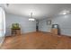 Spacious dining area with hardwood floors and neutral walls, decorated with stylish fish tanks and decor at 119 Tadworth Ct, Mebane, NC 27302