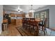 Inviting dining area with hardwood floors, natural light, and seamlessly connects with the kitchen at 119 Tadworth Ct, Mebane, NC 27302