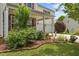Charming home featuring a covered front porch with stone accents and a manicured yard at 119 Tadworth Ct, Mebane, NC 27302