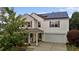 Inviting two-story home with solar panels, attached garage, and charming stone-accented front porch at 119 Tadworth Ct, Mebane, NC 27302