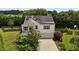 Charming two-story home with solar panels, attached garage, and well-maintained lawn at 119 Tadworth Ct, Mebane, NC 27302