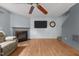 Cozy living room featuring a fireplace, a flat screen TV, and a comfortable recliner for ultimate relaxation at 119 Tadworth Ct, Mebane, NC 27302