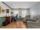 Comfortable living space with a desk, plush recliners, and natural light from the windows at 119 Tadworth Ct, Mebane, NC 27302