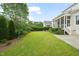 Expansive backyard offers plenty of space for outdoor activities and features lush landscaping at 121 Hardy Oaks Way, Holly Springs, NC 27540