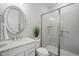 Updated bathroom features modern vanity, granite countertops, and sleek glass shower at 121 Hardy Oaks Way, Holly Springs, NC 27540