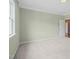 Large bedroom with light green walls and hardwood flooring visible in doorway at 121 Hardy Oaks Way, Holly Springs, NC 27540