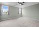 Spacious bedroom features neutral carpet, ceiling fan, and natural light at 121 Hardy Oaks Way, Holly Springs, NC 27540