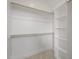 Simple closet featuring shelving and hanging space with wooden rod at 121 Hardy Oaks Way, Holly Springs, NC 27540