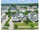 Beautiful two-story home featuring a stone facade, well-manicured lawn and a spacious driveway in a lovely neighborhood at 121 Hardy Oaks Way, Holly Springs, NC 27540