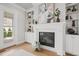 Elegant fireplace with decorative mantel, built in book shelves and hardwood floors at 121 Hardy Oaks Way, Holly Springs, NC 27540