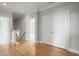 Upstairs hallway with hardwood floors leading to bedrooms and closet space at 121 Hardy Oaks Way, Holly Springs, NC 27540