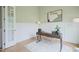 Comfortable home office with wainscotting, a large window, and hardwood floors at 121 Hardy Oaks Way, Holly Springs, NC 27540