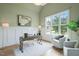 Comfortable home office with wainscotting, a large window, and hardwood floors at 121 Hardy Oaks Way, Holly Springs, NC 27540