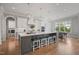 Spacious kitchen with a large island, pendant lighting, barstool seating, and modern appliances at 121 Hardy Oaks Way, Holly Springs, NC 27540