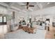 Open-concept living room featuring coffered ceilings and hardwood floors at 121 Hardy Oaks Way, Holly Springs, NC 27540