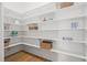Walk-in pantry featuring ample shelving for storage, with hardwood floors and neutral decor at 121 Hardy Oaks Way, Holly Springs, NC 27540