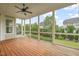 Inviting screened porch with wood flooring and ceiling fan offering serene views of the backyard at 121 Hardy Oaks Way, Holly Springs, NC 27540