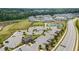 Aerial view of community amenities including a parking lot, sports field, tennis court and playground at 1428 Wrenn Rd, Durham, NC 27703