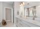 Elegant bathroom with dual vanities, a large mirror, and modern fixtures, for a spa-like experience at 1428 Wrenn Rd, Durham, NC 27703