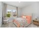 Cozy bedroom with natural light, plush carpet, and calming decor at 1428 Wrenn Rd, Durham, NC 27703