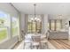 Cozy dining area with natural light and views, seamlessly connected to the living room at 1428 Wrenn Rd, Durham, NC 27703