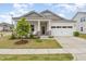 Charming single-Gathering home featuring a welcoming porch, two-car garage, and manicured lawn at 1428 Wrenn Rd, Durham, NC 27703