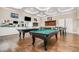 Fun game room with pool table, ping pong, and TVs, ideal for entertaining and leisure at 1428 Wrenn Rd, Durham, NC 27703