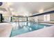 Bright indoor pool with ample natural light, multiple seating areas, and easy access points for swimming at 1428 Wrenn Rd, Durham, NC 27703