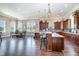 Spacious community kitchen with modern appliances, large island, and dining area, great for entertaining guests at 1428 Wrenn Rd, Durham, NC 27703