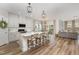 Bright, open-concept kitchen with a large island, modern appliances, and adjacent living area at 1428 Wrenn Rd, Durham, NC 27703